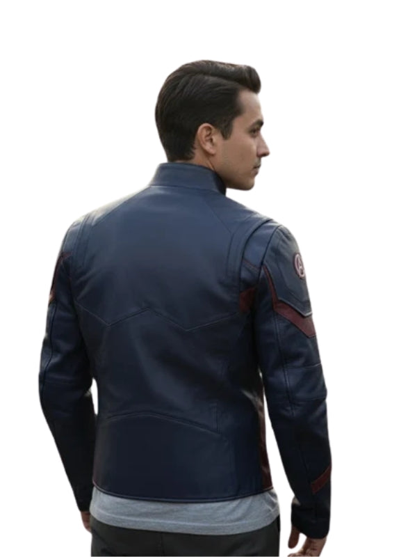 Person wearing a blue jacket with patches on a white background