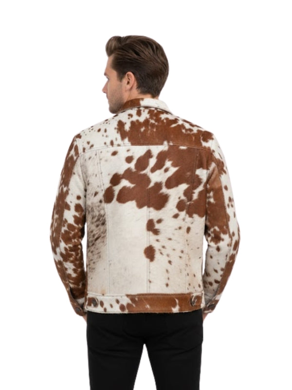 Man wearing a brown and white cowhide leather jacket on a white background
