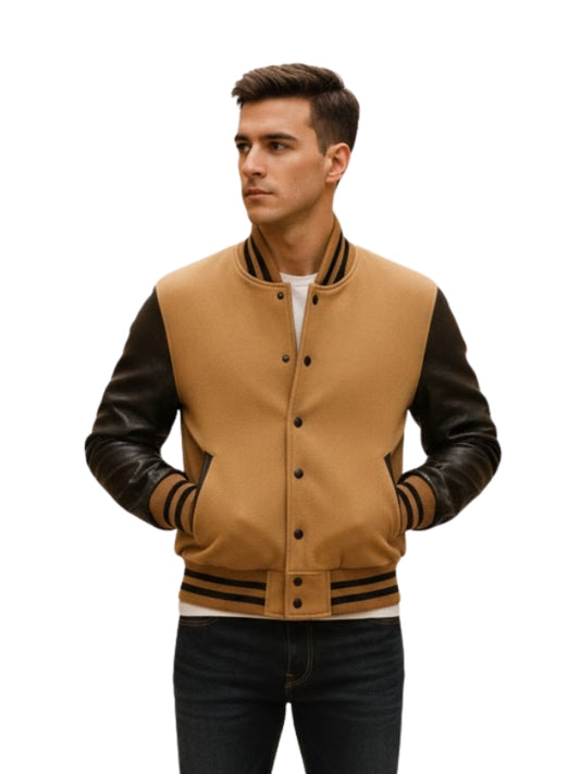 Man wearing a tan and black varsity jacket on a white background