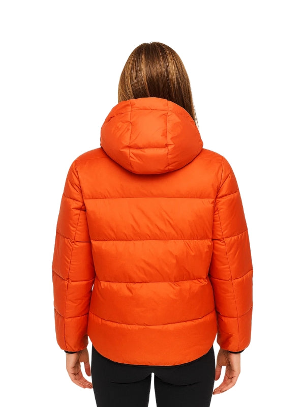 Orange puffer jacket worn by a person on a white background