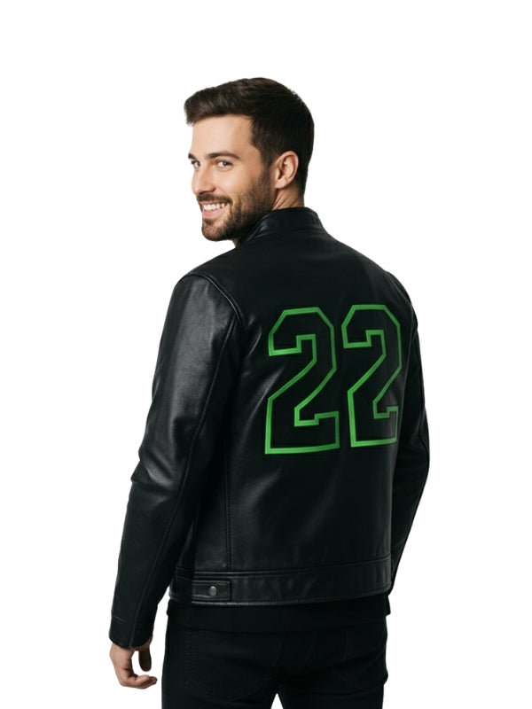 Man wearing a black jacket with green number 22 on the back against a white background