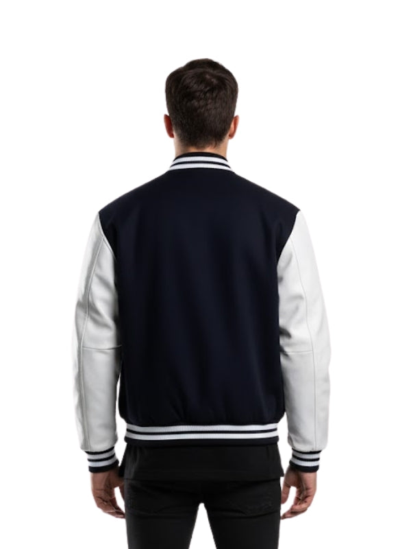 Person wearing a navy and white varsity jacket on a white background