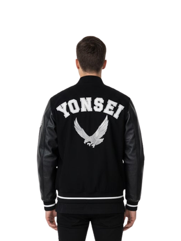 Person wearing a black varsity jacket with 'YONSEI' and an eagle logo on the back.