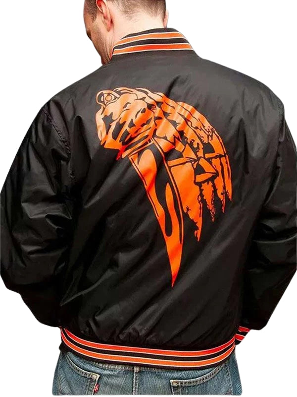 Black jacket with orange panther design on the back, worn by a person.