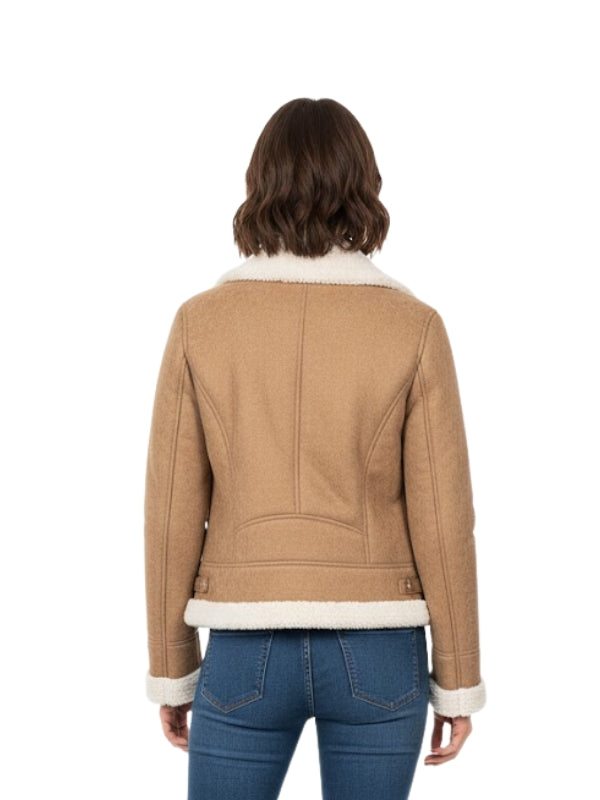 Person wearing a tan jacket with white trim on a white background