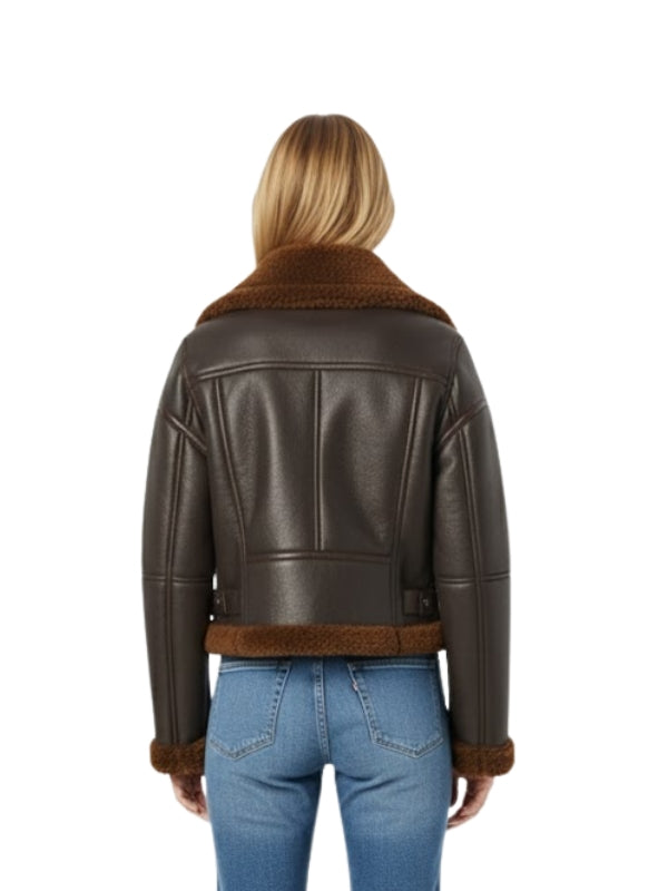 Brown leather jacket with fur trim worn by a person on a white background