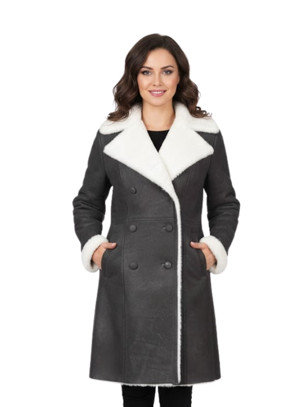Woman wearing a gray coat with white fur trim on a white background