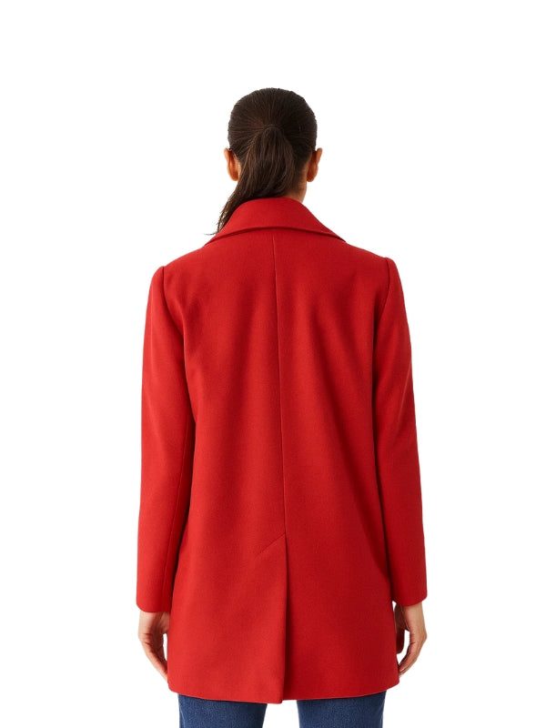 Person wearing a red coat on a white background