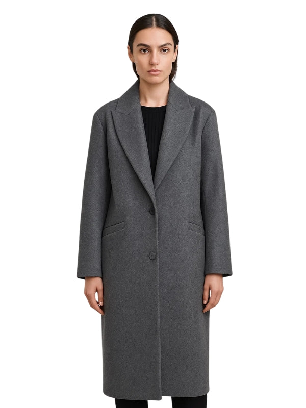 Woman wearing a gray coat on a white background