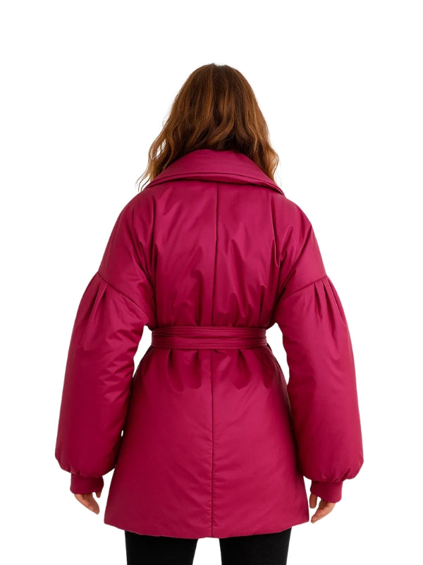 Pink coat worn by a person on a white background