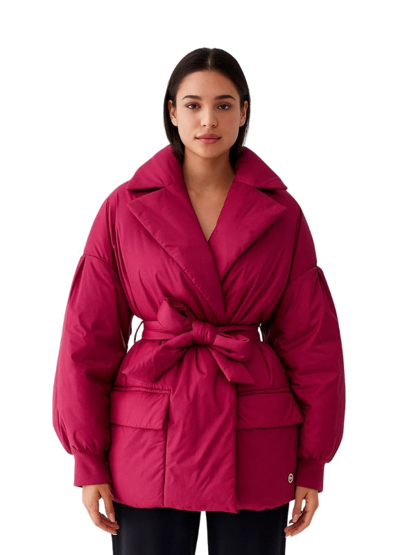 Woman wearing a pink jacket on a white background