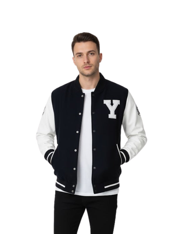 Man wearing a black and white varsity jacket with a 'Y' logo on a white background