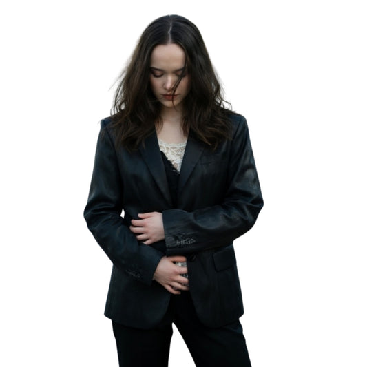 Woman wearing a black suit on a white background