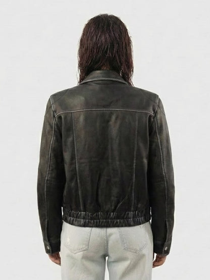Person wearing a dark leather jacket from behind on a white background