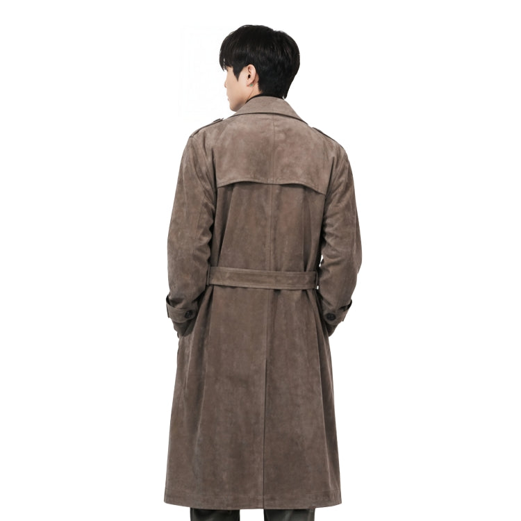 Man wearing a brown trench coat on a white background