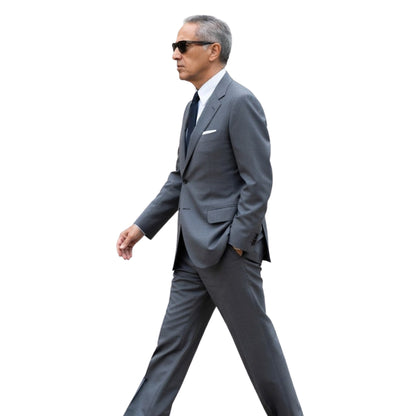 Man in a gray suit walking on a white background
