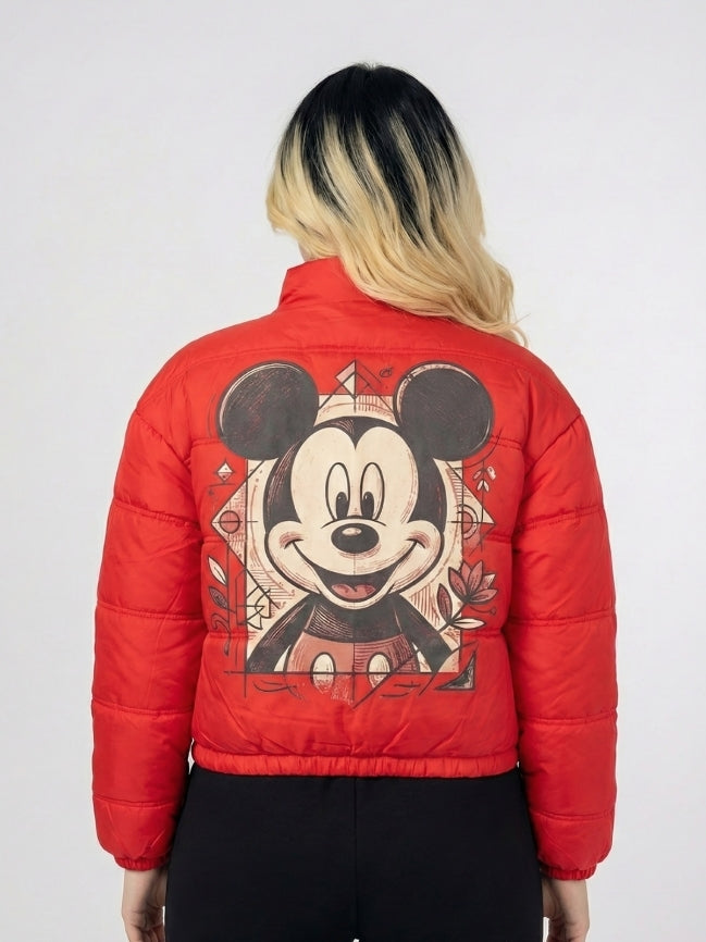 Red puffer jacket with a cartoon character design on the back, worn by a person.