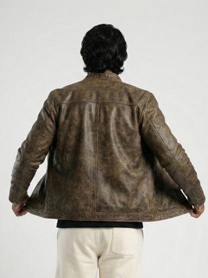 Person wearing a brown leather jacket on a white background