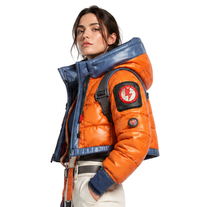 Person wearing an orange and blue jacket with a backpack on a white background