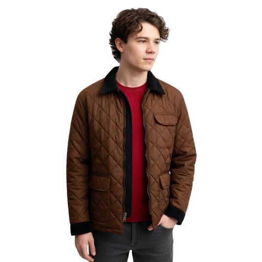 Man wearing a brown quilted jacket over a red shirt on a white background