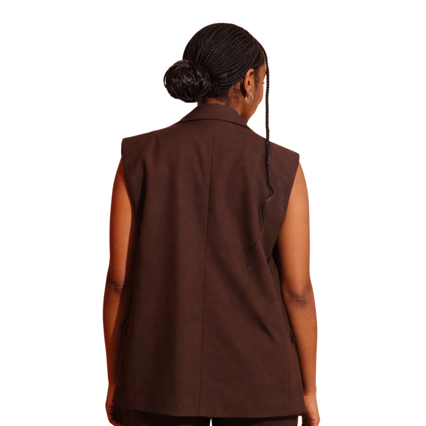 Brown vest worn by a person on a white background