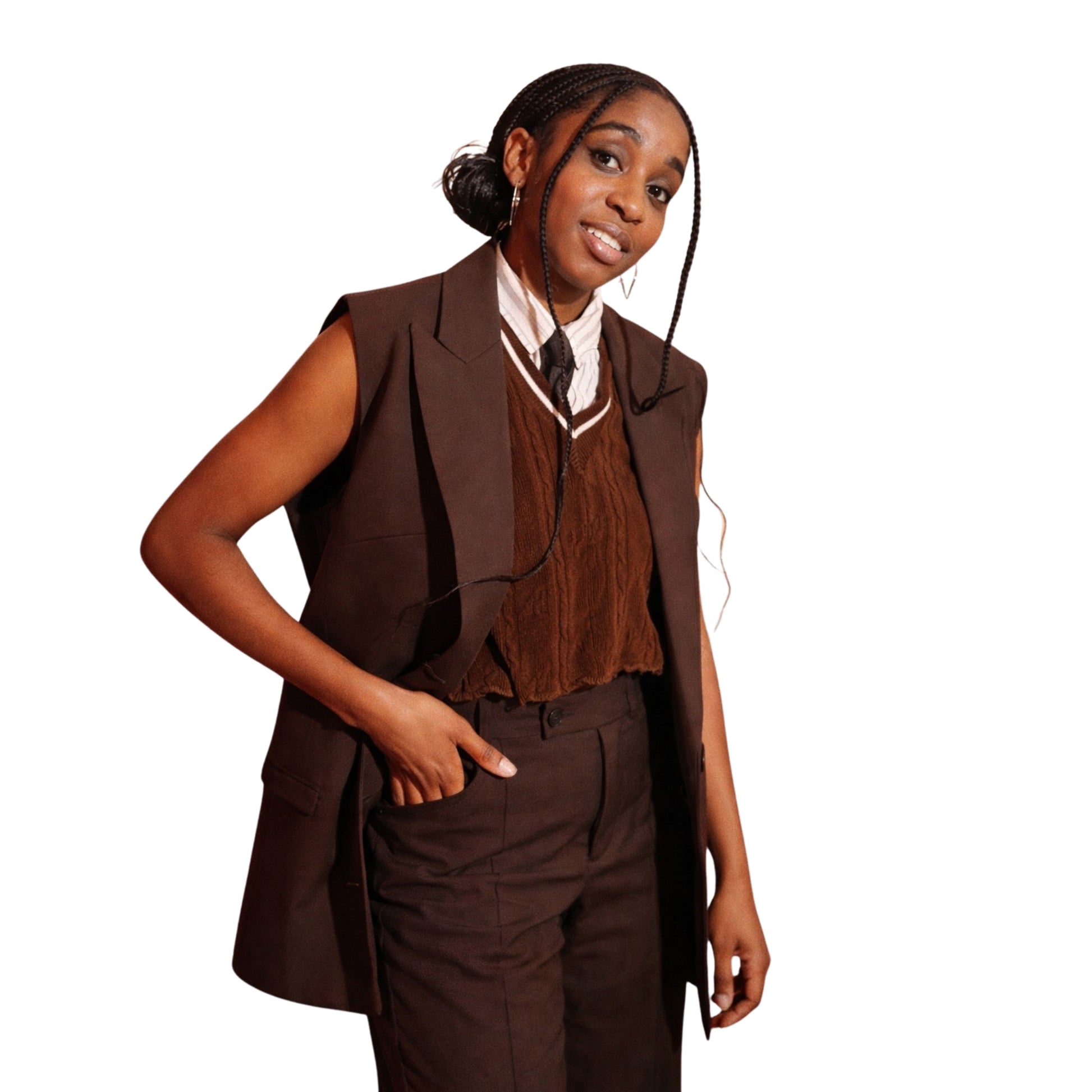 Woman wearing a brown vest and pants set on a white background