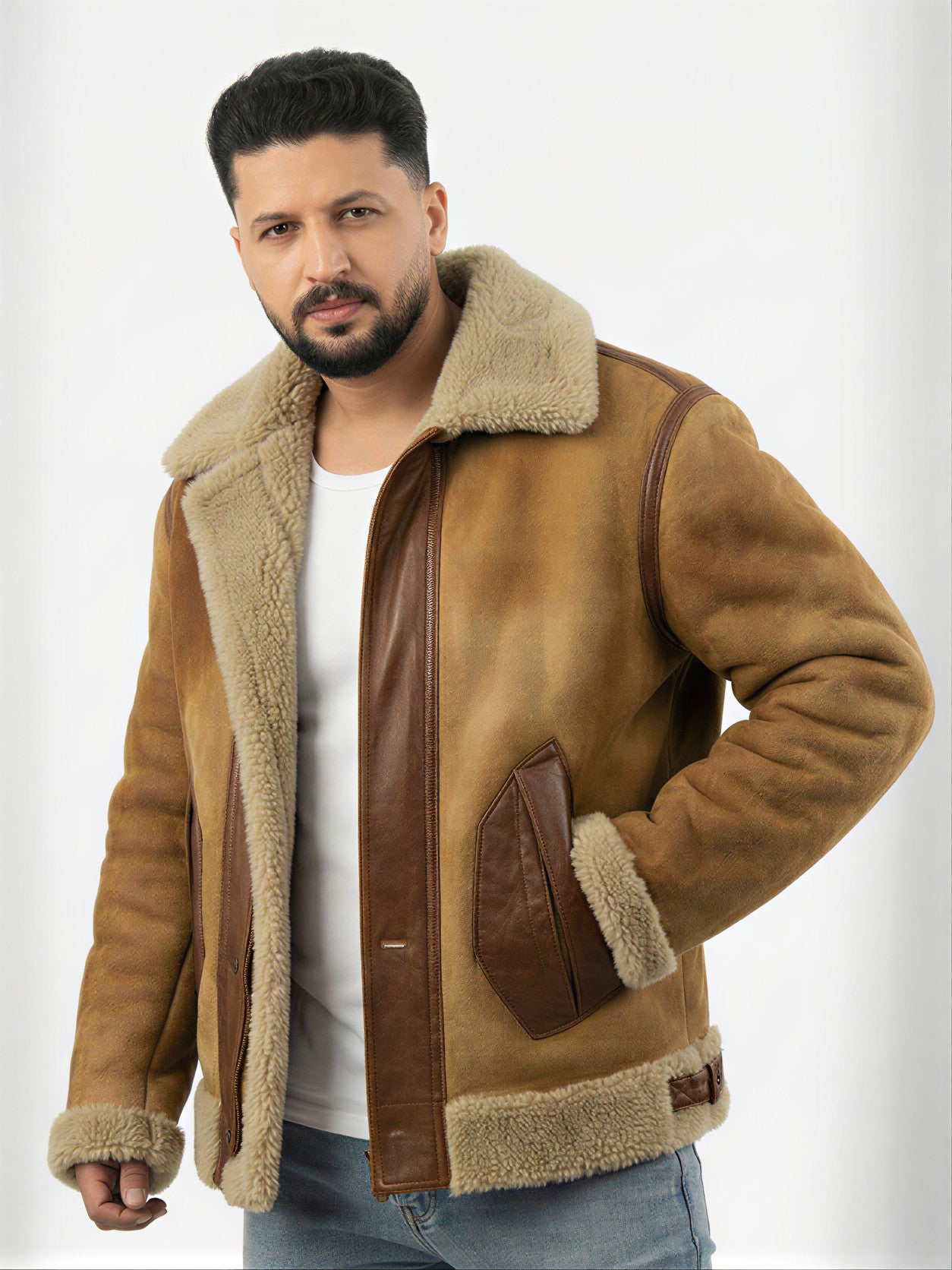 Man wearing a brown shearling jacket on a white background
