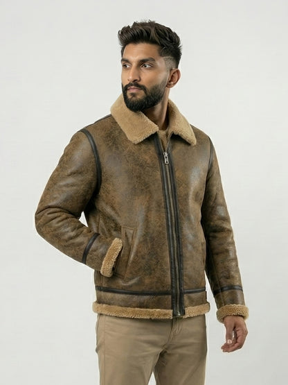 Man wearing a brown leather jacket with shearling collar and cuffs on a white background