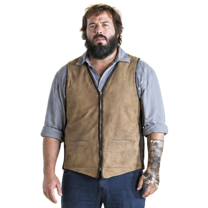 Man wearing a brown vest over a gray shirt on a white background