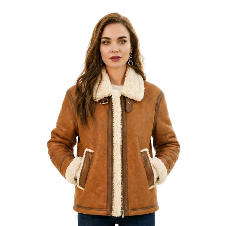 Woman wearing a brown shearling jacket with white fur lining on a white background