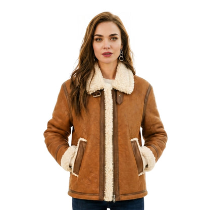 Woman wearing a brown shearling jacket with white fur lining on a white background