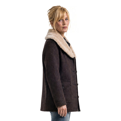 Woman wearing a brown coat with a fur-lined hood on a white background