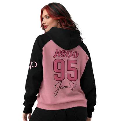 Person wearing a black and pink hoodie with 'Jisoo 95' text on the back.