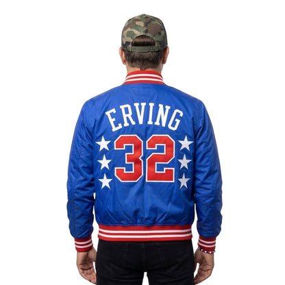 Person wearing a blue jacket with 'E. Irving 32' on the back, standing against a white background