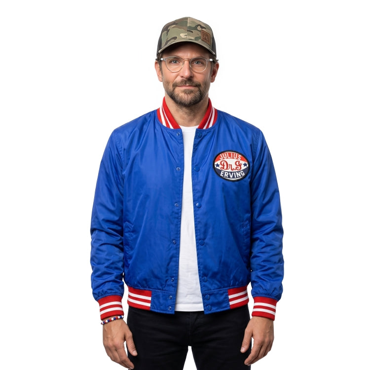 Man wearing a blue jacket with a logo and a cap on a white background