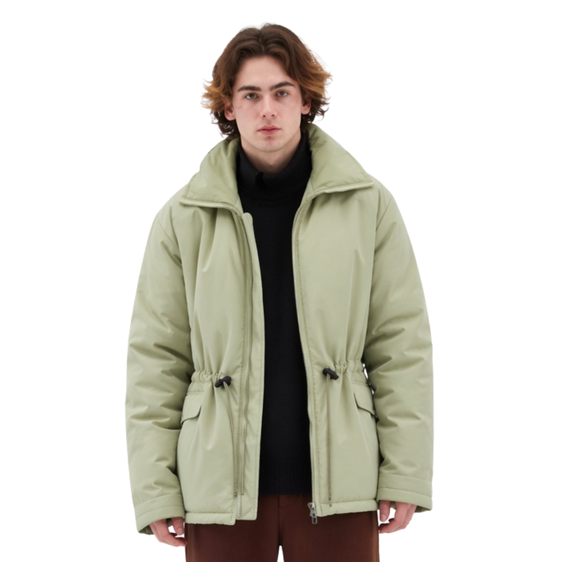Person wearing a light green jacket on a white background