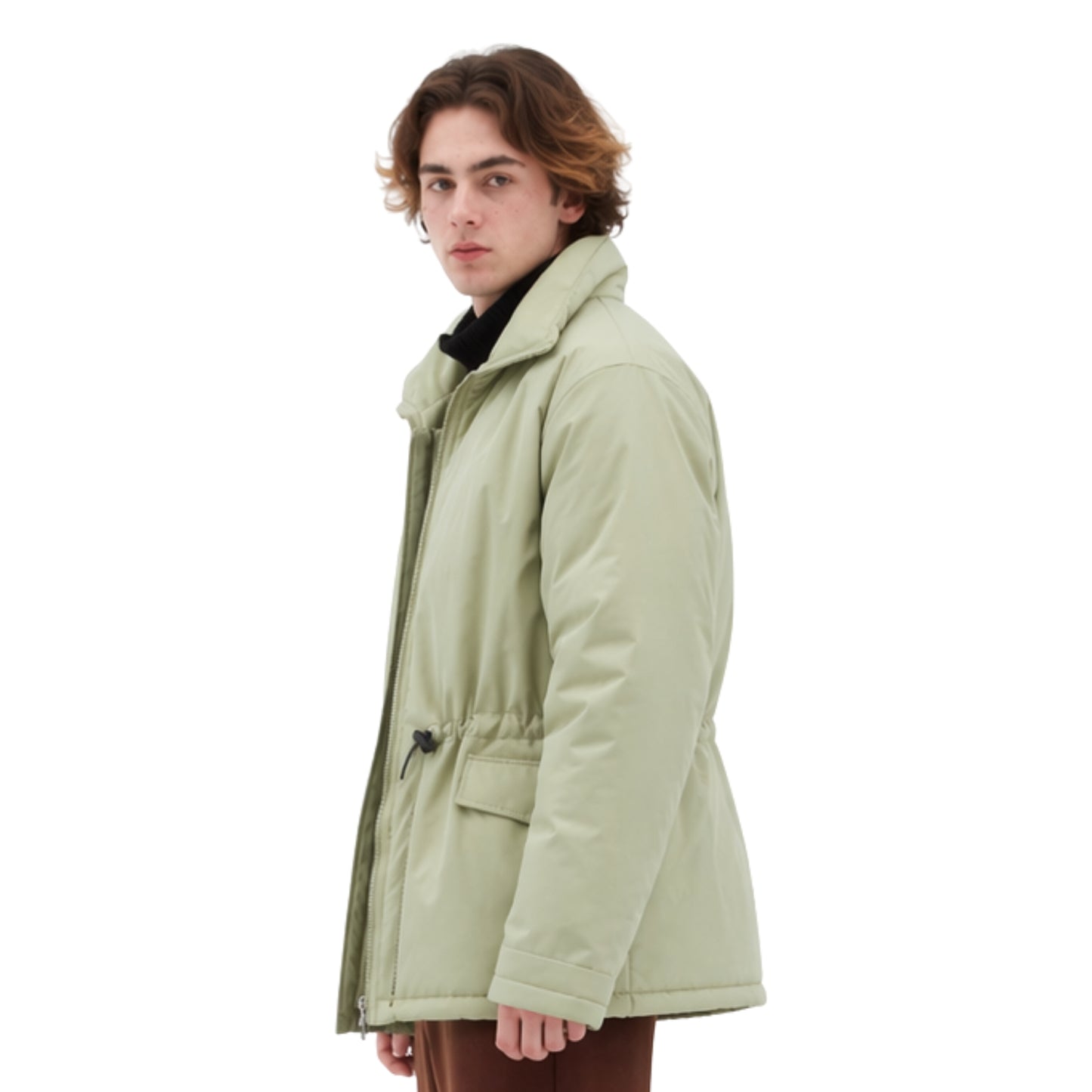 Person wearing a light green coat on a white background