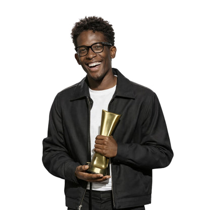 Man holding a gold trophy against a white background