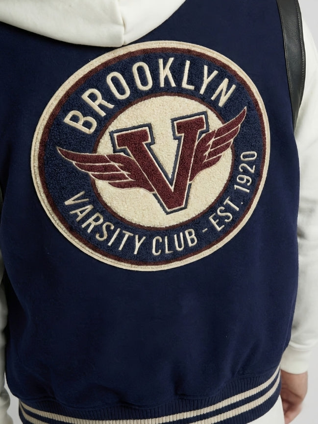 Navy blue jacket with 'Brooklyn Varsity Club' logo on a white background
