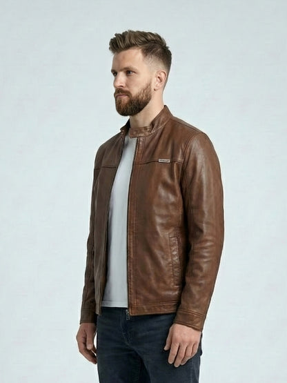 Man wearing a brown leather jacket on a light gray background