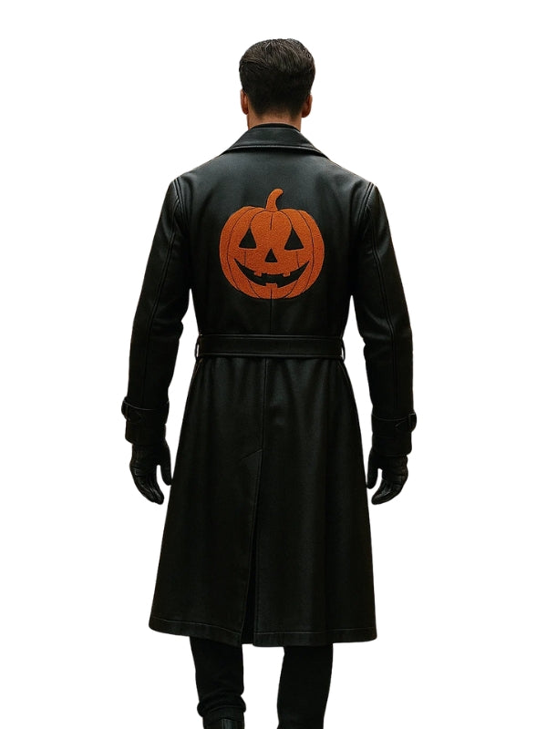 Black coat with a pumpkin design on the back worn by a person on a white background