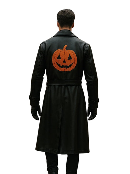 Black coat with a pumpkin design on the back worn by a person on a white background