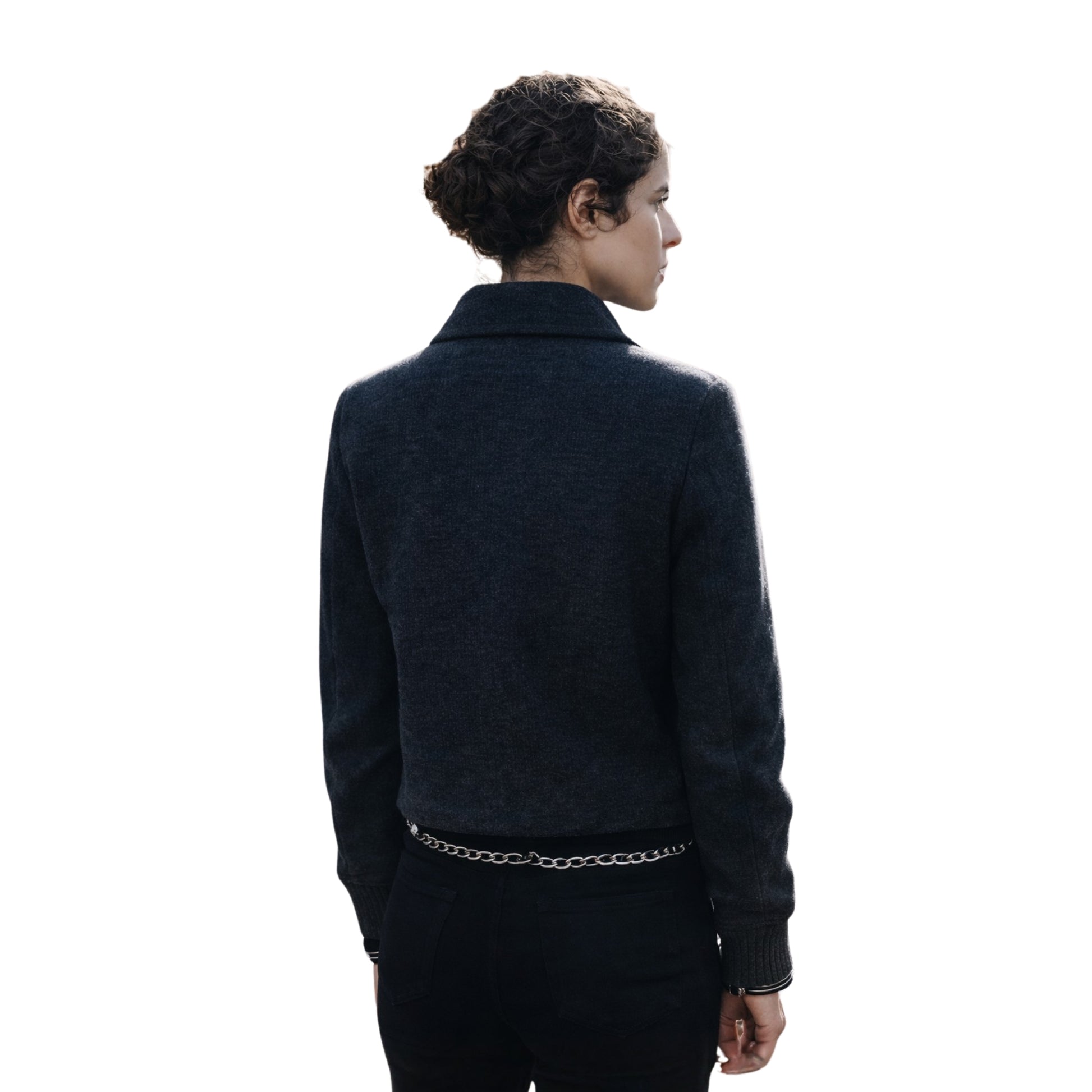 Person wearing a dark jacket on a white background