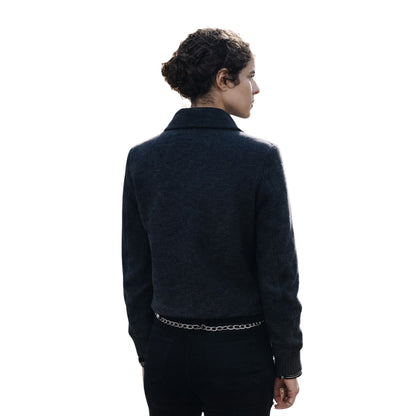 Person wearing a dark jacket on a white background