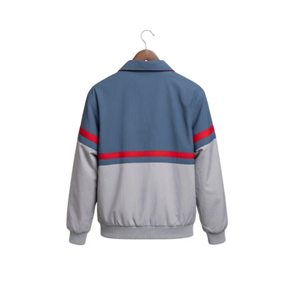Gray and blue jacket with red stripes on sleeves, hanging on a white background
