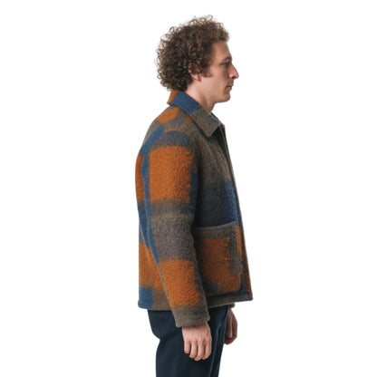 Man wearing a plaid jacket on a white background