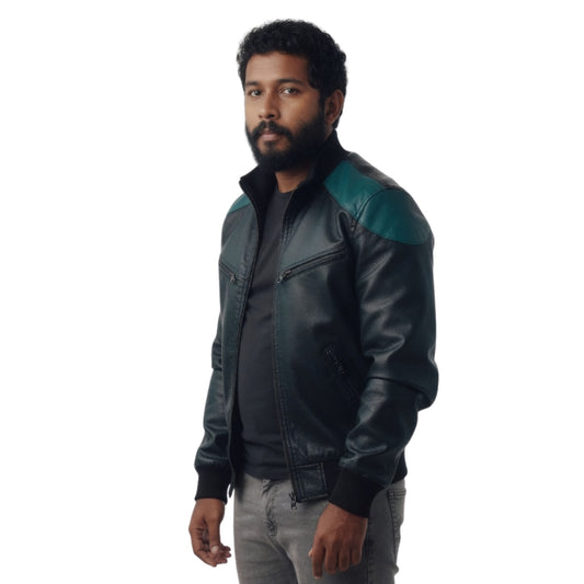 Man wearing a black leather jacket with green accents on a white background