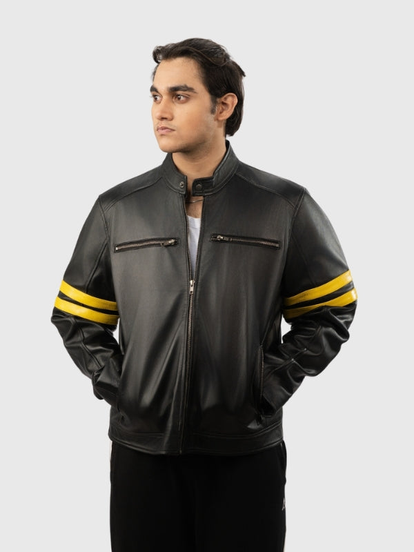 Man wearing a black leather jacket with yellow stripes on a white background