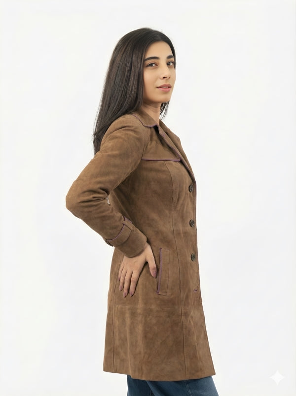 Woman wearing a brown suede coat on a white background