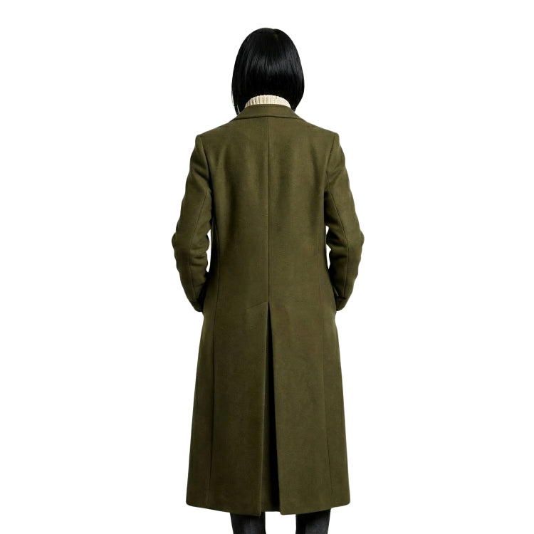 Person wearing a long olive green coat on a white background